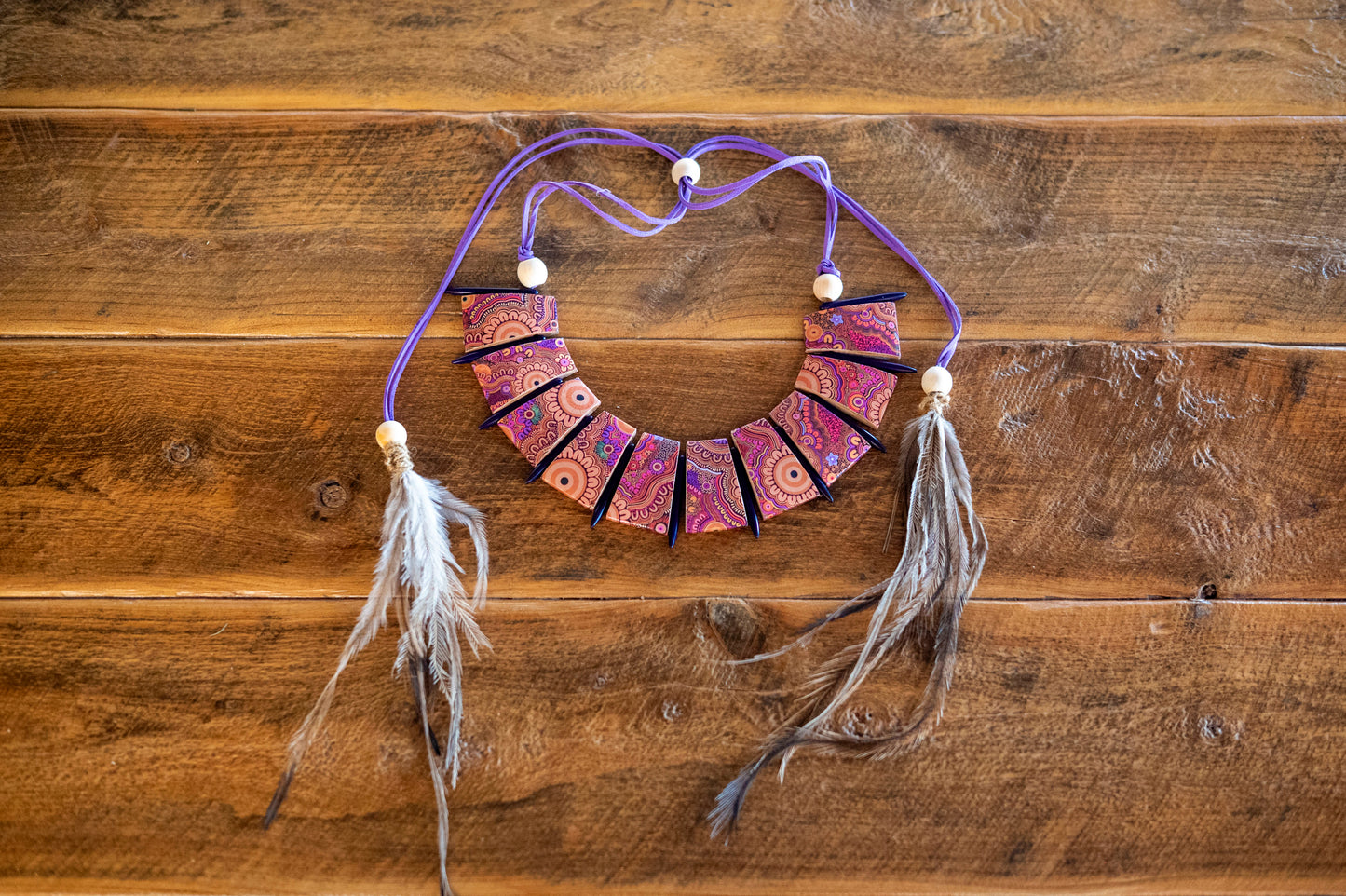 Stolen Generations paper and wooden bead necklace