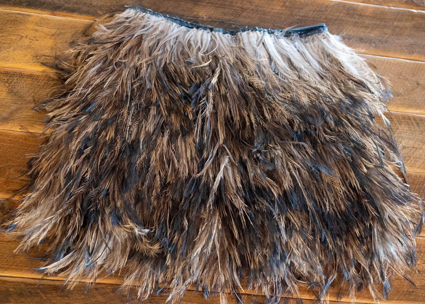 Emu feather skirt + woven basket
